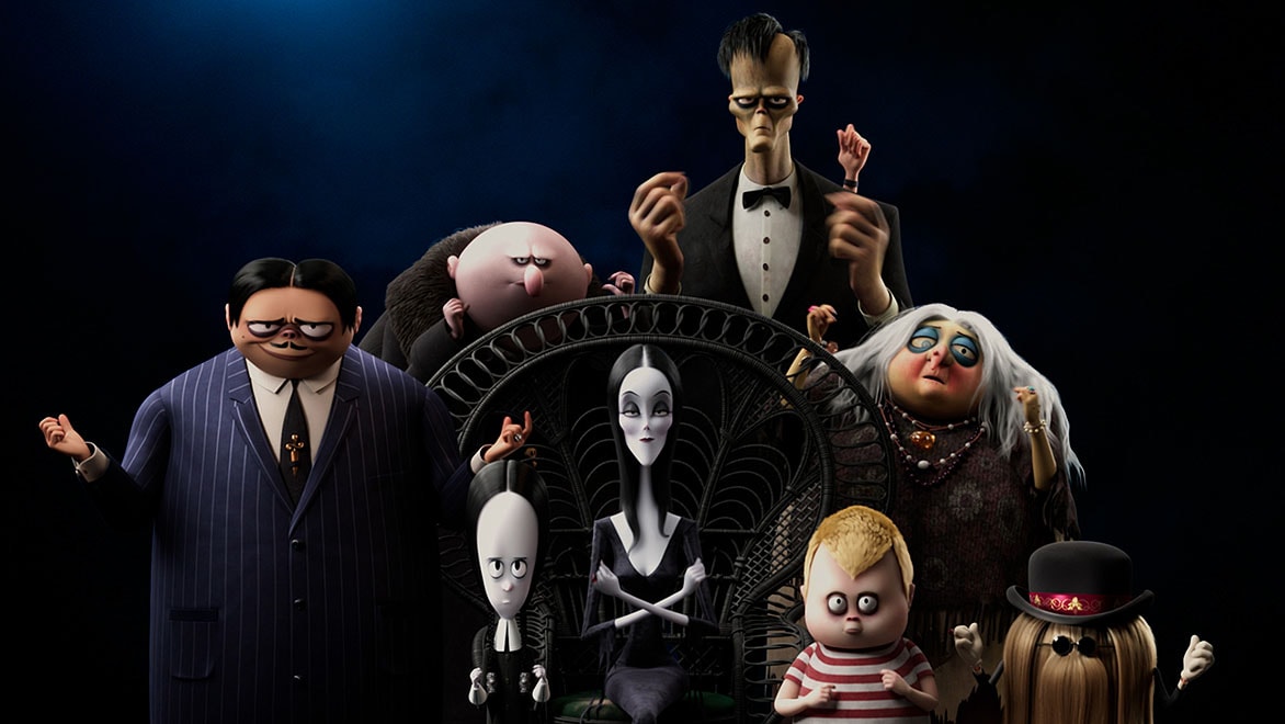 Eight Addams Family characters sitting for a portrait